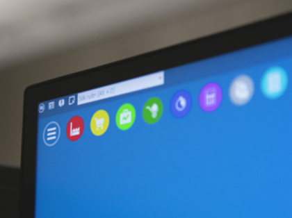 A close up of a computer screen with a blue background displaying Monitor ERP.