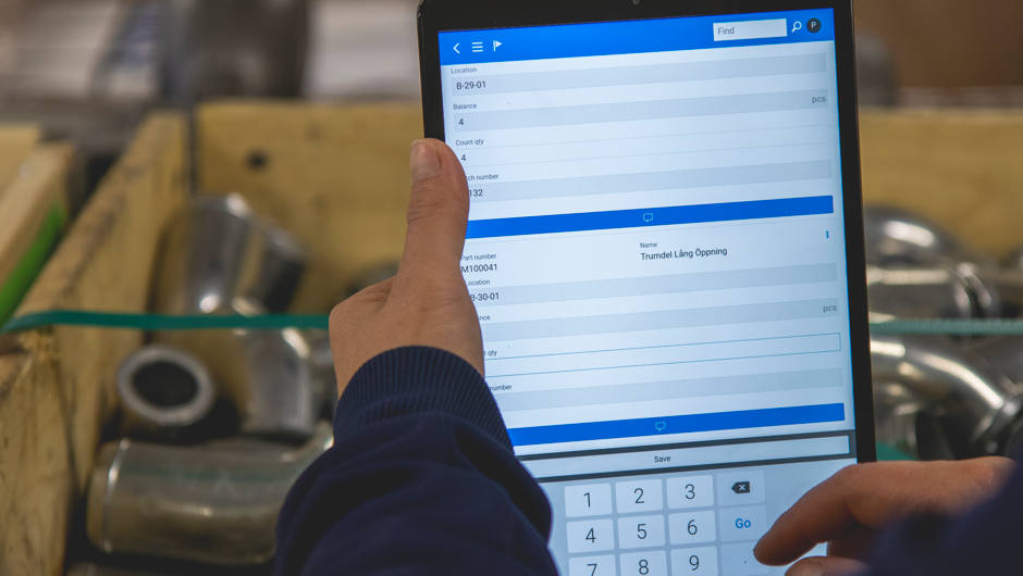 A person holding a tablet computer in their hands.