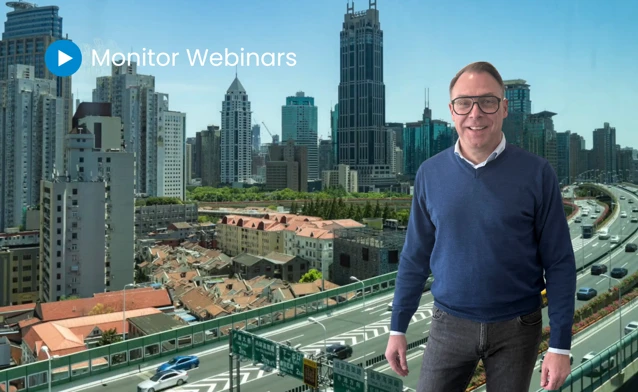 A man standing in front of a city skyline.