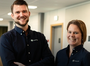 A man and a woman standing next to each other.