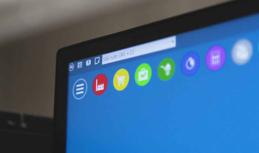 A close up of a computer screen with a blue background displaying Monitor ERP.