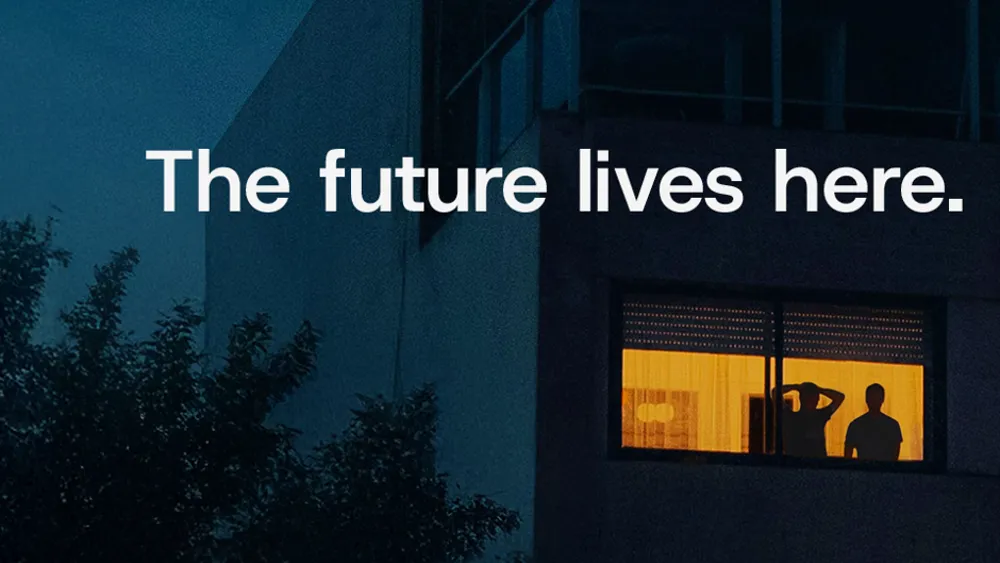 A building with people looking out of the windows.