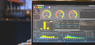 Monitor ERP dashboard displayed on a laptop in a factory environment