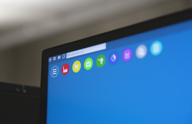 A close up of a computer screen with a blue background displaying Monitor ERP.