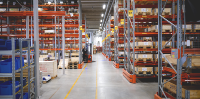 A large warehouse filled with lots of shelves.
