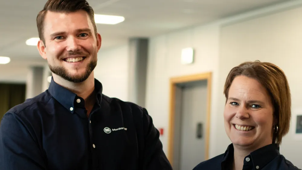 A man and a woman standing next to each other.