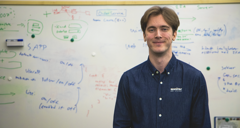 Viktor Rosvall standing in front of a white board