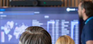 A man at Monitor ERP giving a presentation to a group of people about Monitor BI (business intelligence)