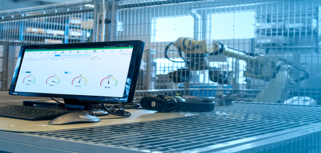 A desktop computer sitting on top of a metal table.