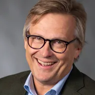 A man who is smiling. 