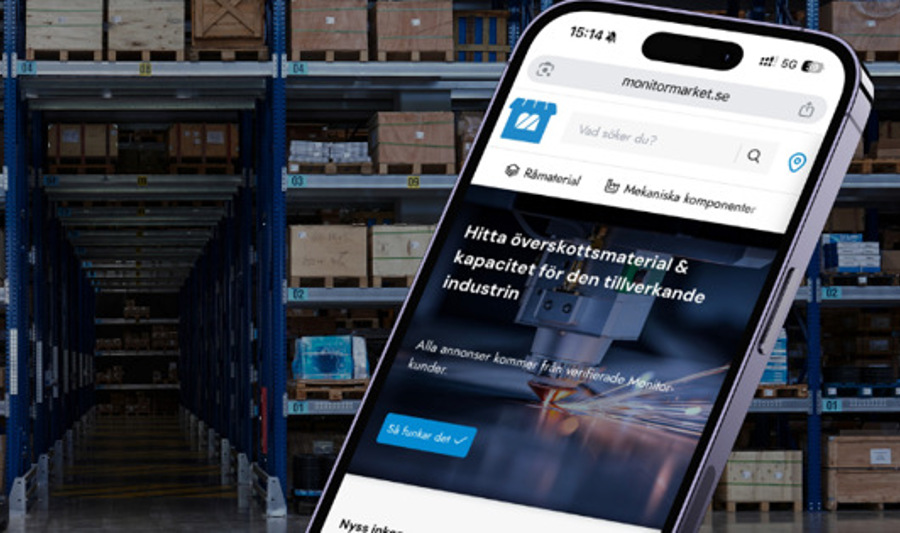 A cell phone in the middle of a warehouse.