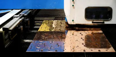 A machine that is cutting a piece of metal.