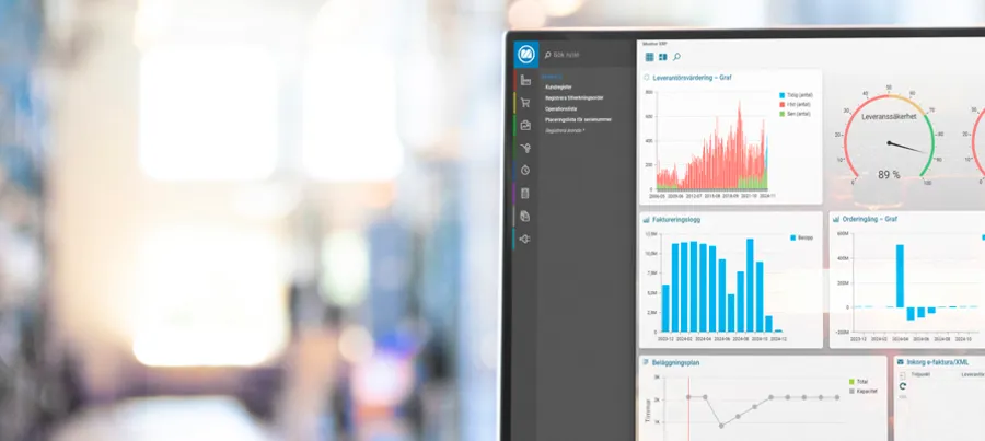 Desktop in industry warehouse displaying Monitor ERP dashboard