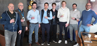 A group of men standing next to each other.