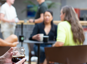 A woman sitting in front of a group of people.