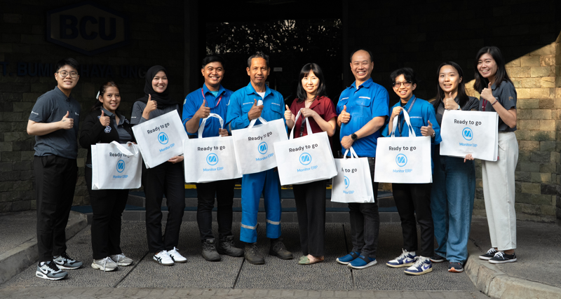 The PT Bumi Cahaya Unggul and Monitor ERP teams in front of the BCU office.