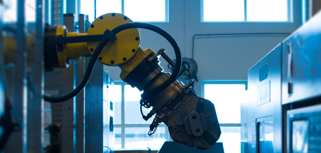 A robot is working on a machine in a factory.