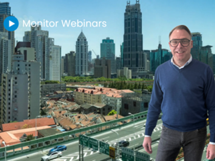 A man standing in front of a city skyline.