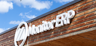 A sign of Monitor ERP on the side of the Monitor ERP headcourter in Sweden, Hudiksvall