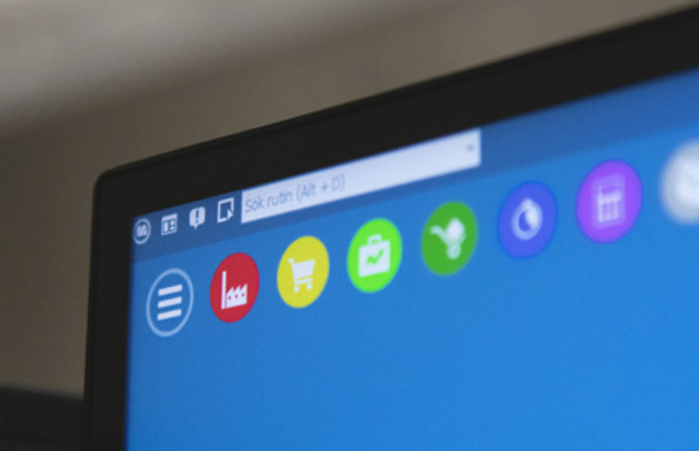 A close up of a computer screen with a blue background displaying Monitor ERP.
