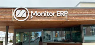 A sign of Monitor ERP on the side of the Monitor ERP headcourter in Sweden, Hudiksvall