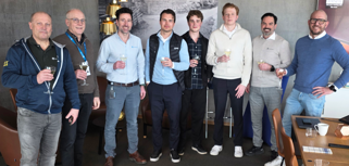 A group of men standing next to each other.