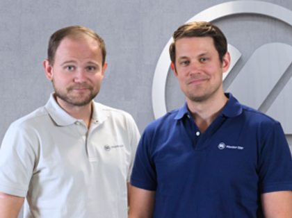 A couple of men standing next to each other.