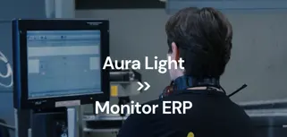 A man working on a monitor in a factory.