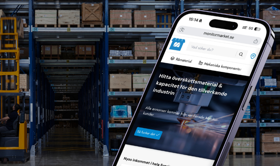 A cell phone in the middle of a warehouse.