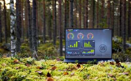 Illustration of Monitor ERP dashboards on a screen placed in nature, symbolizing sustainability.