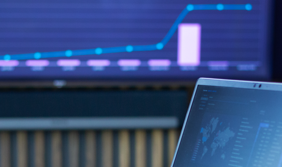 laptop on a table showing Monitor ERP Dashboard
